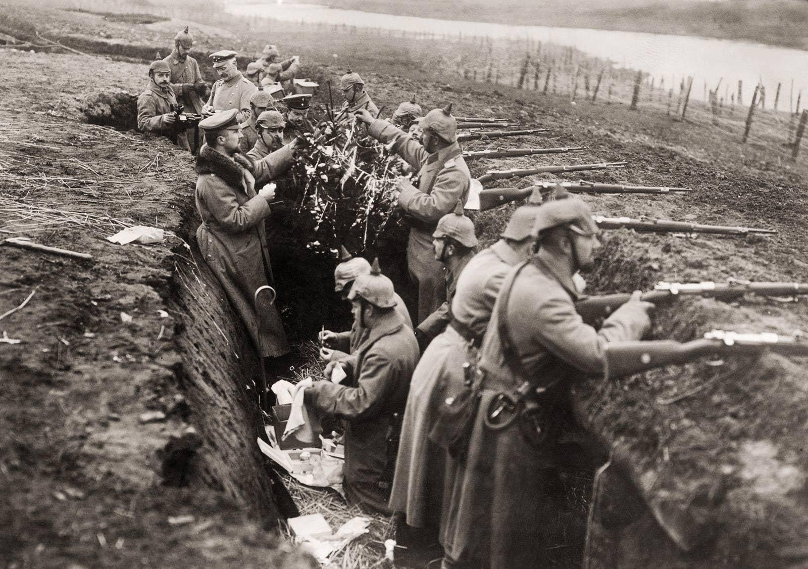 German soldiers decorating a tree on the Western Front during WWI. (1914) [1600×1126]