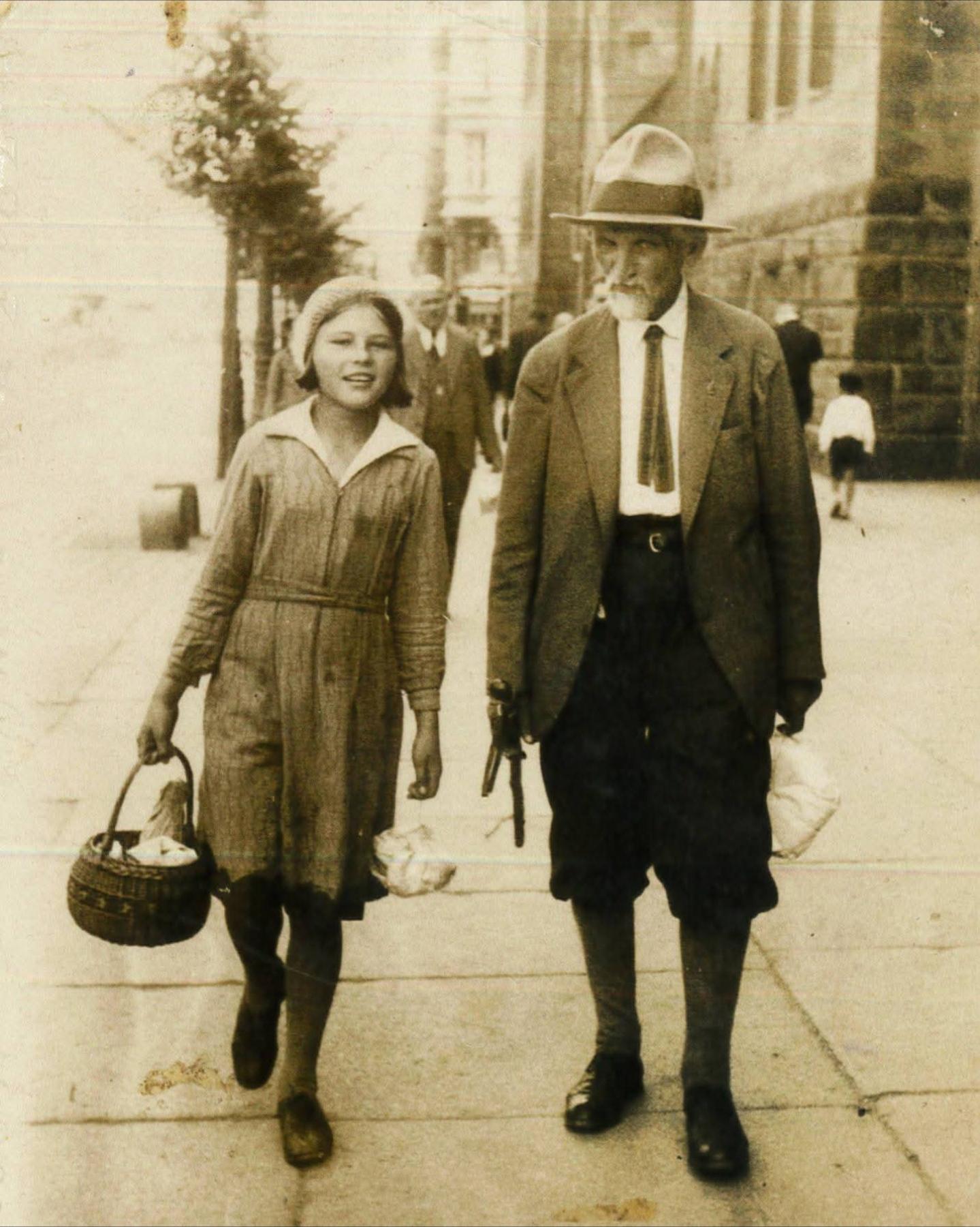 People walking down the street in Poznań, Poland, 1938. [1439×1800]