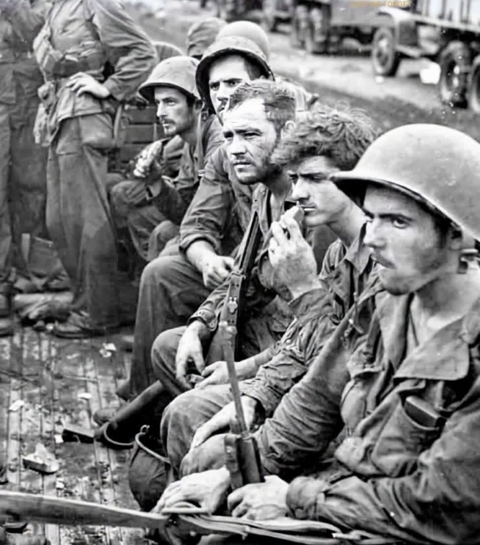 Weary Marines just off the front lines after 23 days on Cape Gloucester, January 1944 [976×1109]