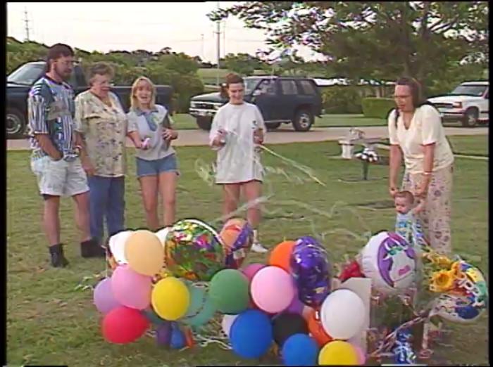 Darlie Routier pouring the silly string on the headstones of her children, Rowlett 1996. Later she will be sentenced for the murder of her own children. To this day case is very divisive, but law enforcement say that they are sure of her guilt.[700×522]