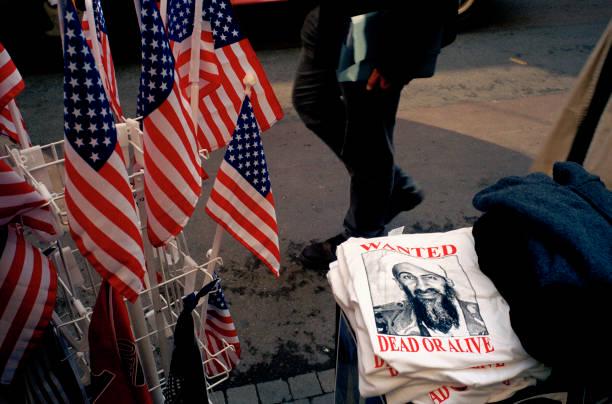 Street stall in Manhattan selling Osama Bin Laden “Wanted Dead or Alive” T Shirts, October 1st, 2001 [612×401]