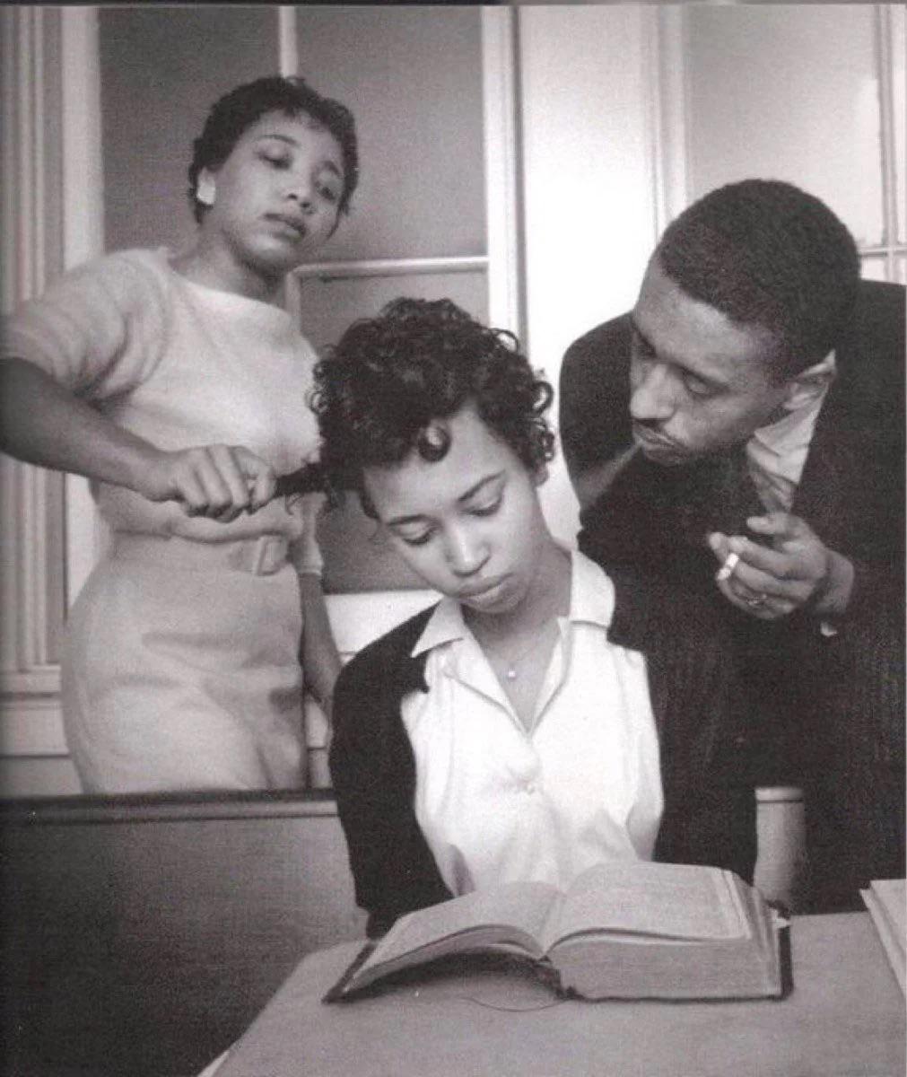A young girl in a school for Black civil rights activists being trained to not react to smoke blown in her face, 1960. [1011 x 1200]