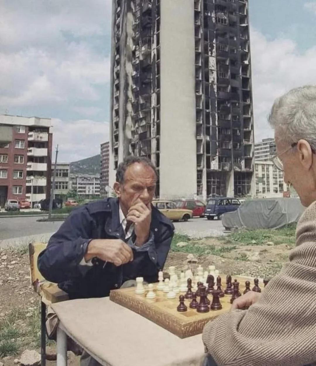 Two men playing chess during Sarajevo Siege, Bosnia, 1994. [1080×1251]