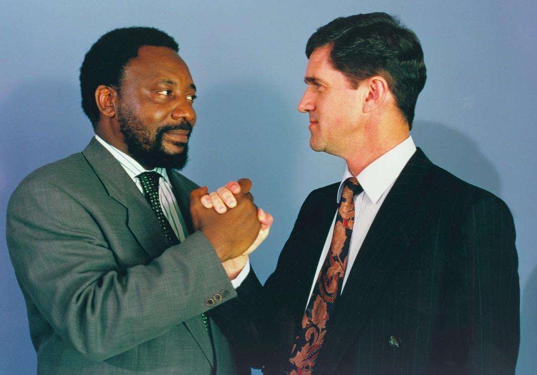 A 1995 photograph of the two men responsible for negotiating the end of white minority rule in South Africa (current South African president Cyril Ramaphosa and his newly appointed ambassador to the US, Roelf Meyer). [1070×747]