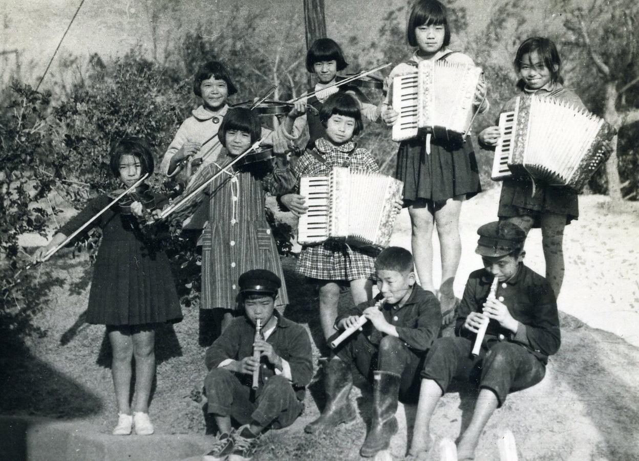 Children with musical instruments at Kitami Primary School. Okinawa, Japan, 1960 [1248×901]
