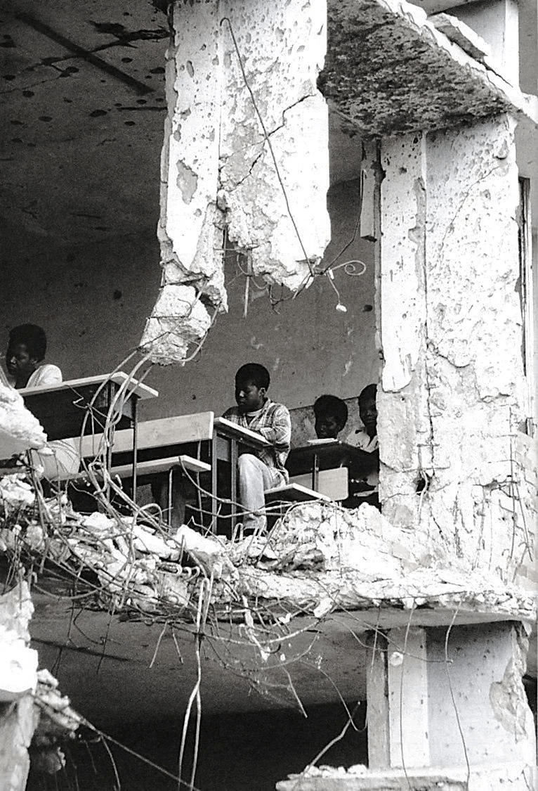 Classes in a destroyed school, Angola, 1997. [766×1125]