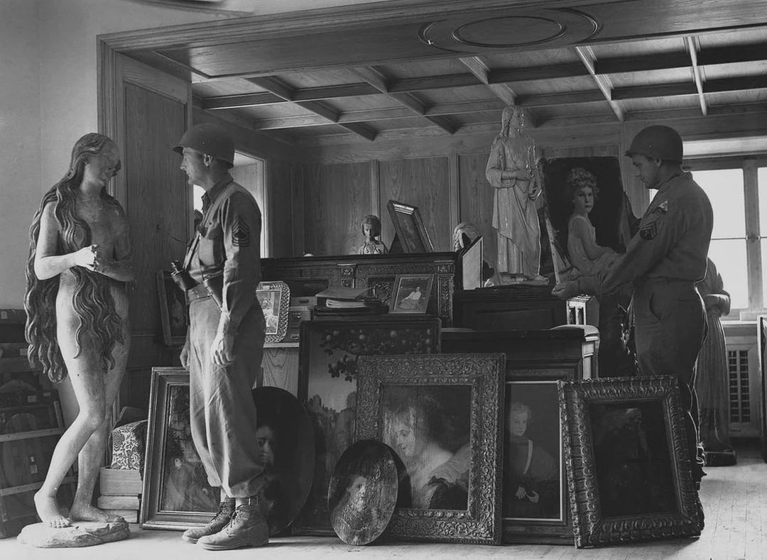 Photograph of two U.S. soldiers with dozens of pieces of art stolen by Hermann Göring, found in a cave in Schönau am Königsee, Germany, 1945. [1080×789]