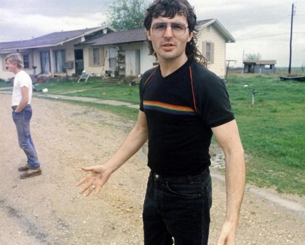 Branch Davidian leader David Koresh speaks with Waco Tribune-Herald journalists during a 1988 tour of Mount Carmel, amid an internal power struggle within the group, coverage portraying him and his followers sympathetically[1284X1034].