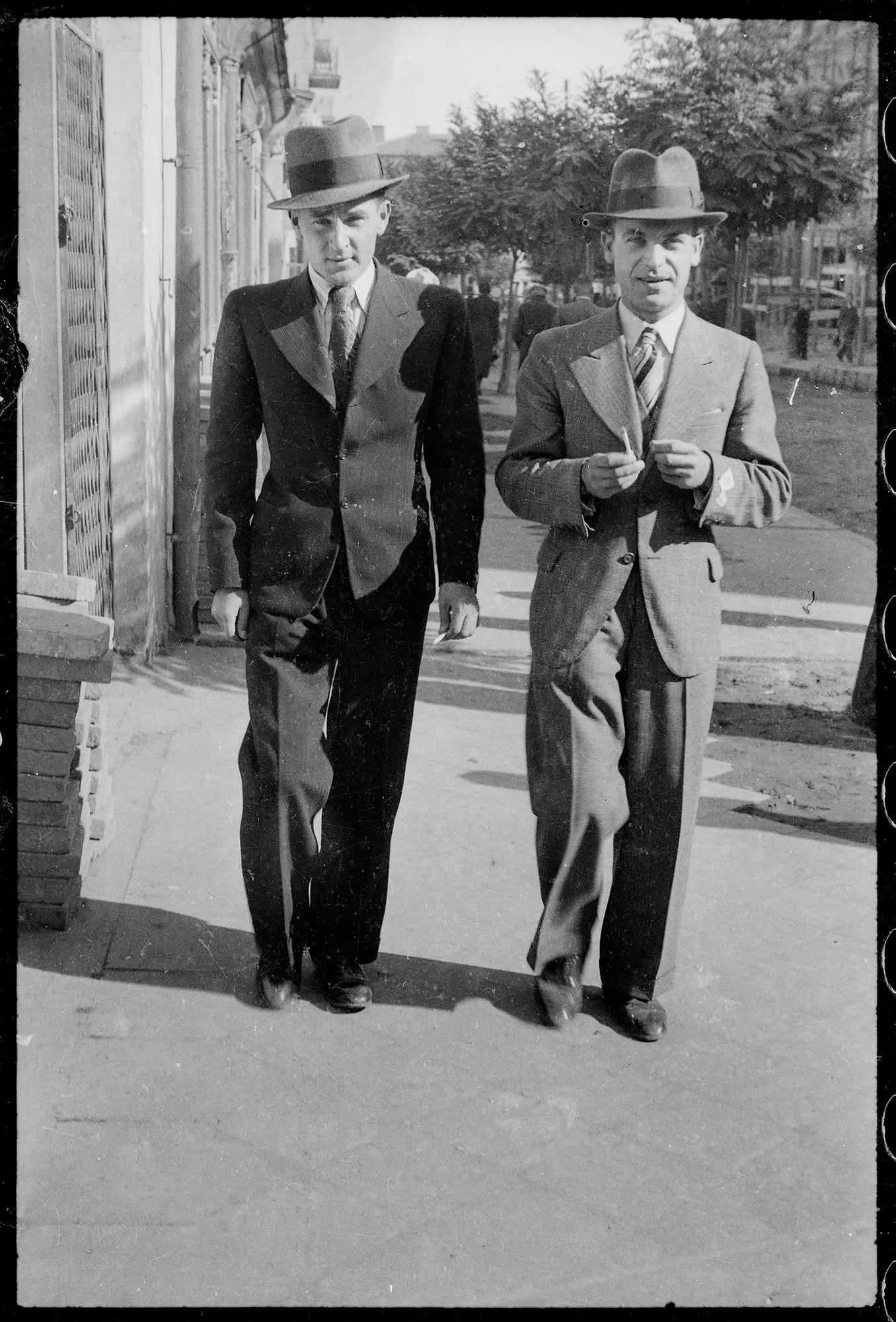 Two men walking down Kilińskiego Street in Białystok, Poland, 2 October 1938. Photo by Bolesław Augustis. [1356×2000]