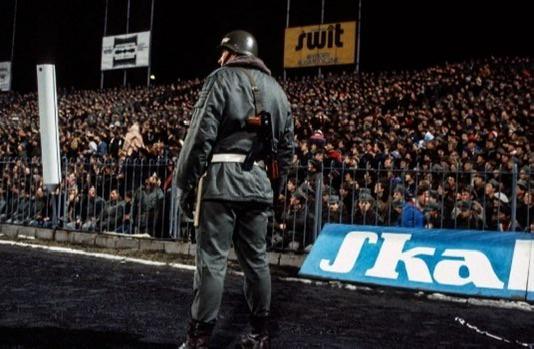 Member of the Motorized Reserves of the Citizens’ Militia (ZOMO) standing guard during a football match between Legia Warsaw and Dynamo Tbilisi – in the Polish Army Stadium — in Warsaw, during the quarter-finals of the European Cup Winners’ Cup on March 3rd, 1982. [534 x 349]