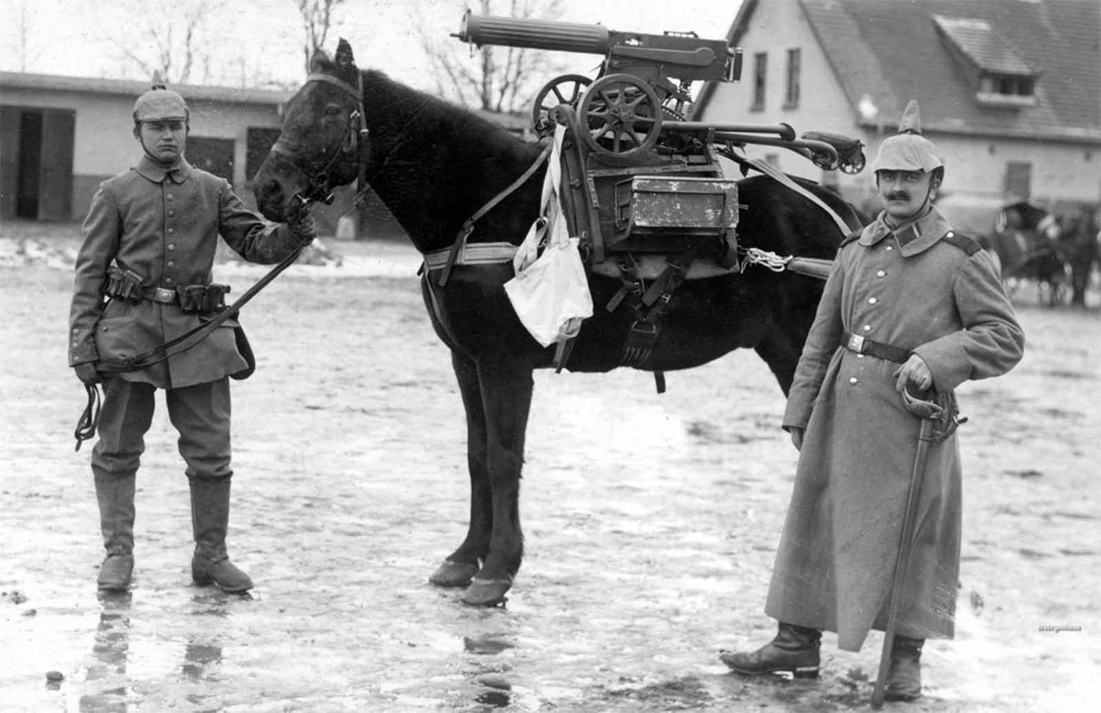 German soldiers pose near a horse mounted with a purpose-built frame used to accommodate a captured Russian Maxim M1910 machine gun. (1914) [1600×1037]
