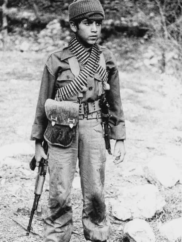 An Iranian child soldier during the Iran-Iraq War, 1980s. [600×798]