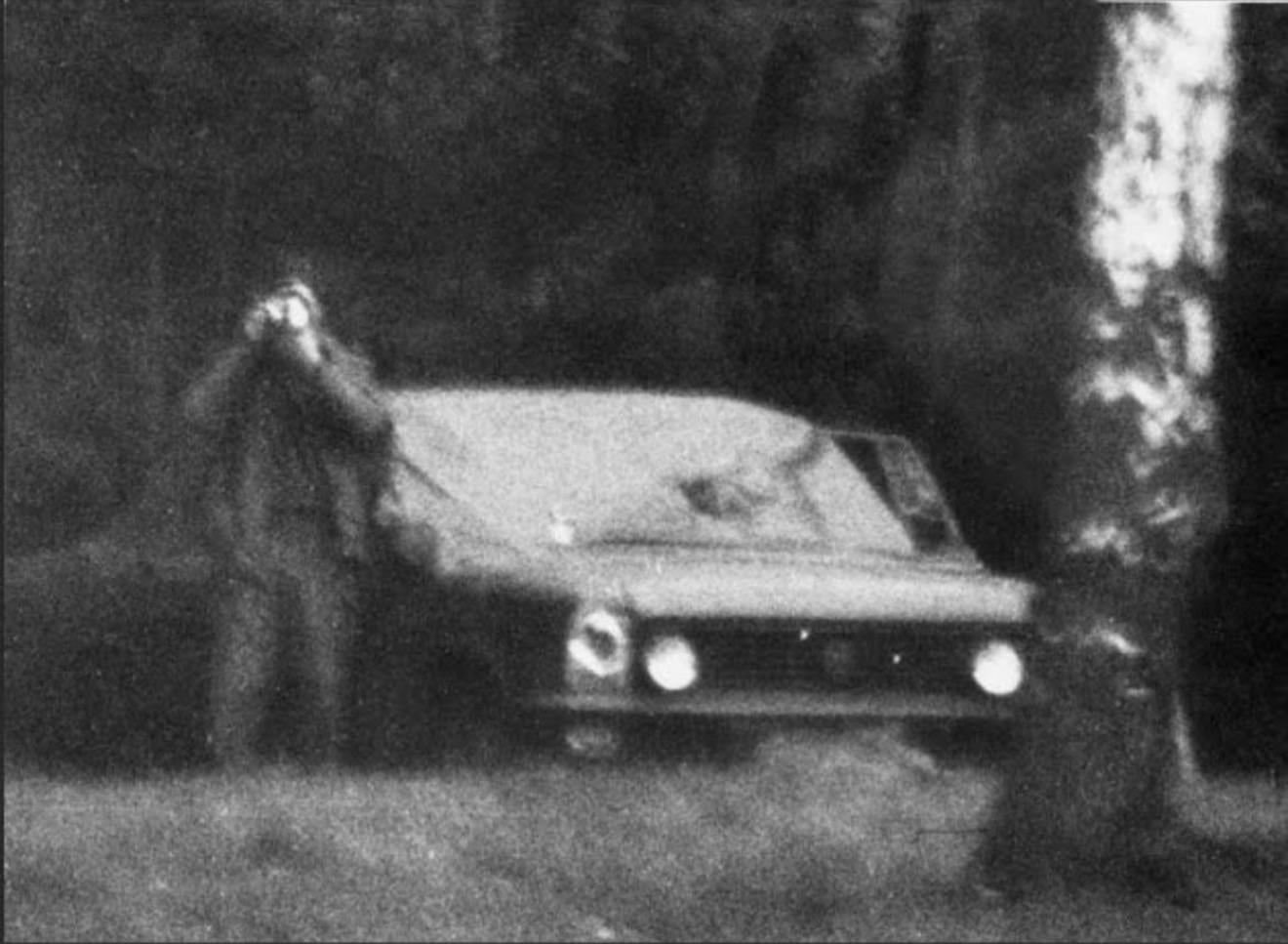 Stasi agent watching the camera man – who was taking his photograph – in a forest, in the German Democratic Republic (DDR), c. 1970s. [1320 x 967]