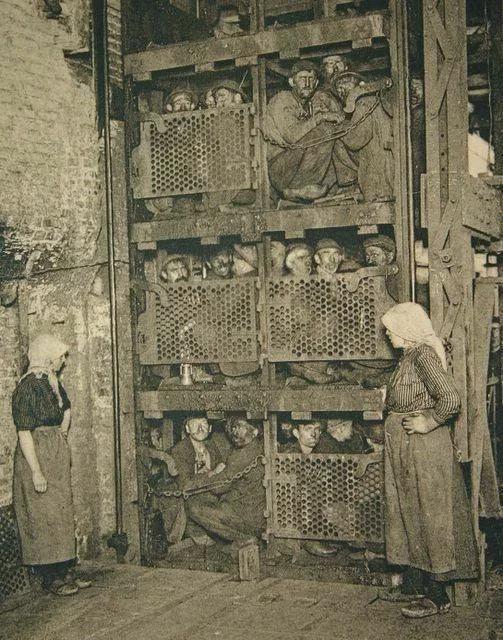 Miners coming up a Coal Mine Elevator after a day of work in Belgium, 1920. [503×640]