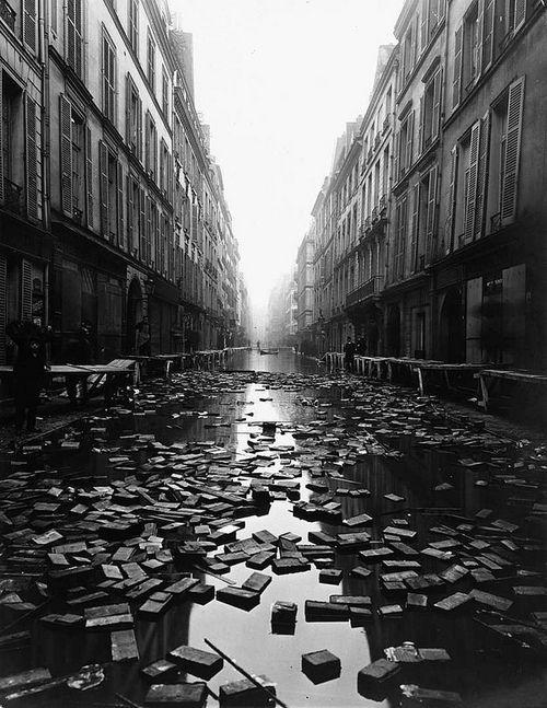 Library books float down the street during the Great Flood of Paris, 1910, [500×647]