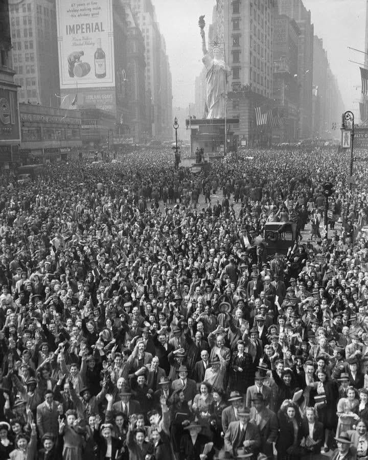 A massive crowd celebrating the surrender of Germany in Times Square, New York City, on May 7, 1945. [720×900]