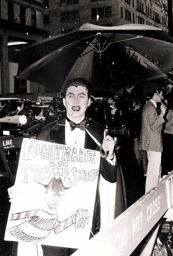 An ACT up protester holding a sign depicting Donald Trump as Freddie Krueger, 1989 [590 x 870]