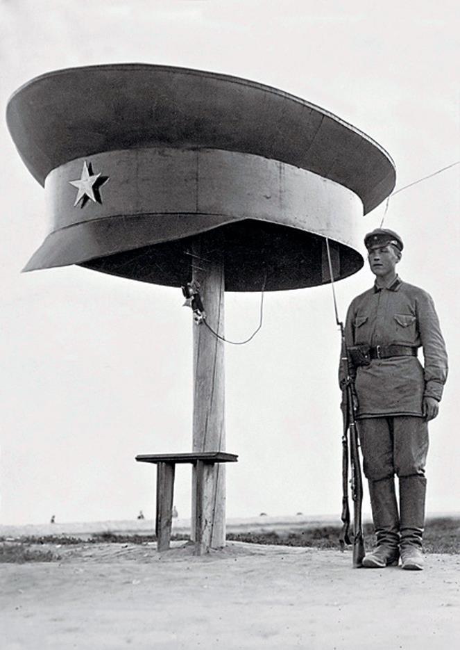 Soldier guards telephone booth on a beach near Leningrad. Soviet Russia – near Leningrad, 1925 [697×1100]