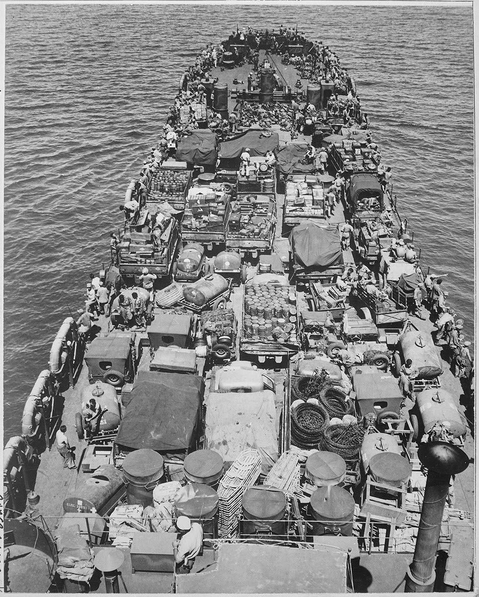 Crammed with Marines and material for the invasion of Cape Gloucester, New Britain, this Coast Guard manned LST nears the Japanese held shore. December 26, 1943. [964×1200]