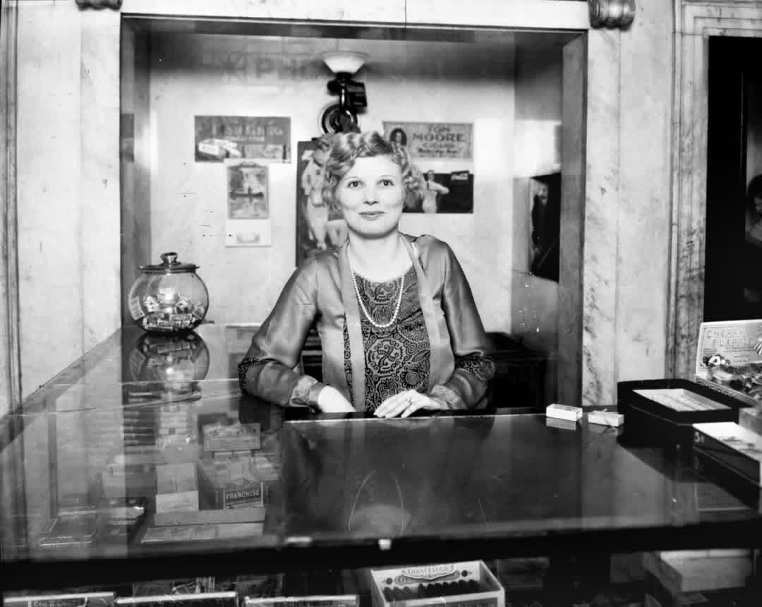 Cigar/Cigarette girl in the lobby of the Dallas, TX Courthouse, 1920s [1080×860]