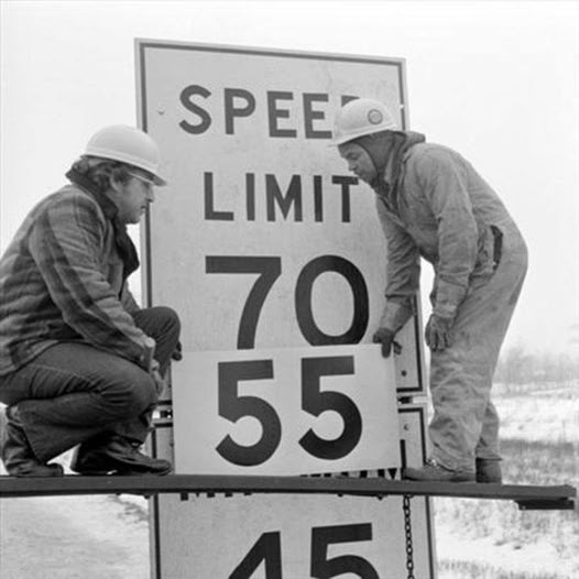 Workers change speed limit signage due to the National Maximum Speed Law signed into law by Richard Nixon, 1974 [526×526]