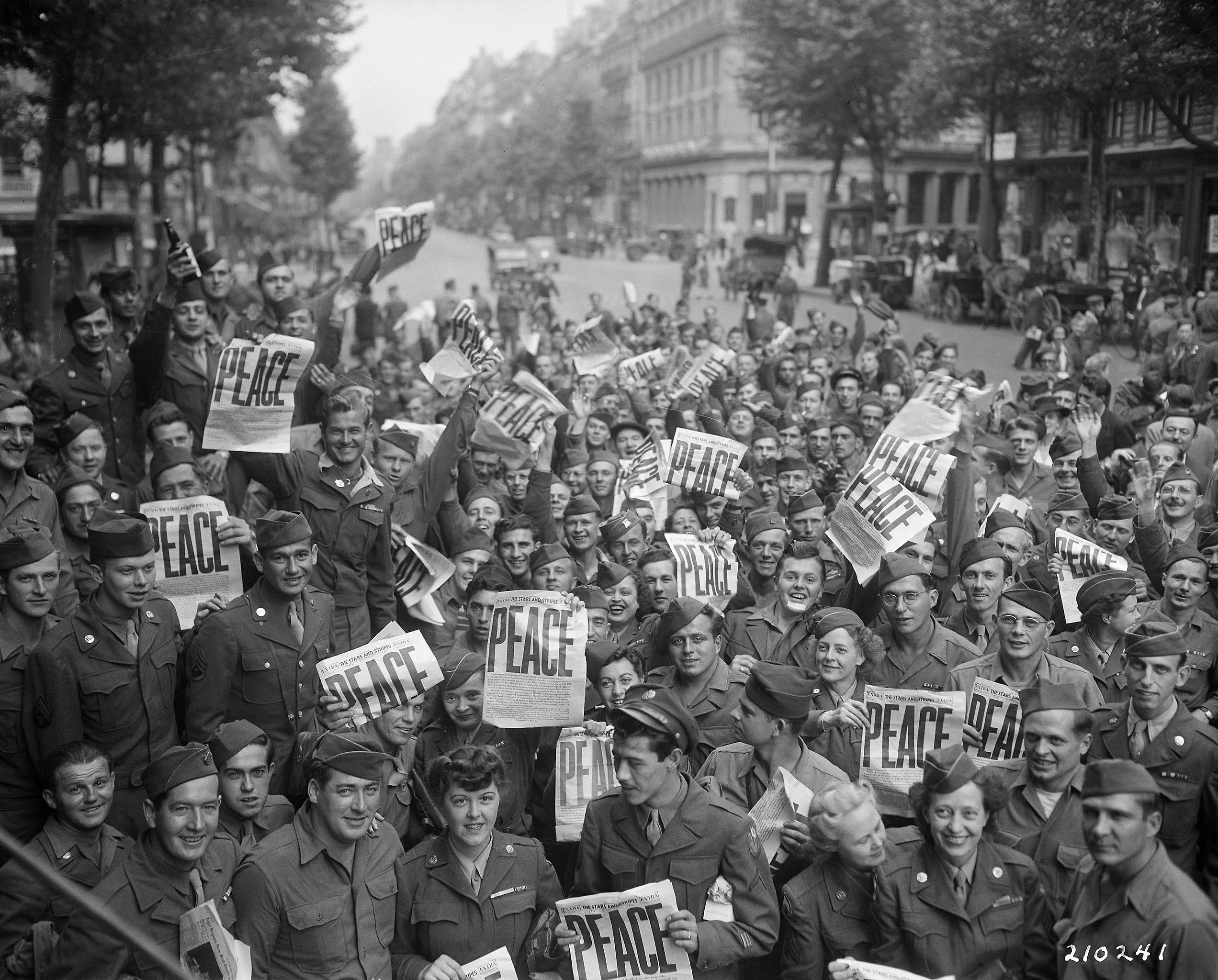 American military personnel celebrating the Japanese surrender in Paris, marking the end of WWII. (1945) [2544×2048]