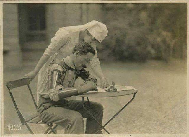 French Soldier with two prosthetic arms learning to write again, WW1. [640×464]