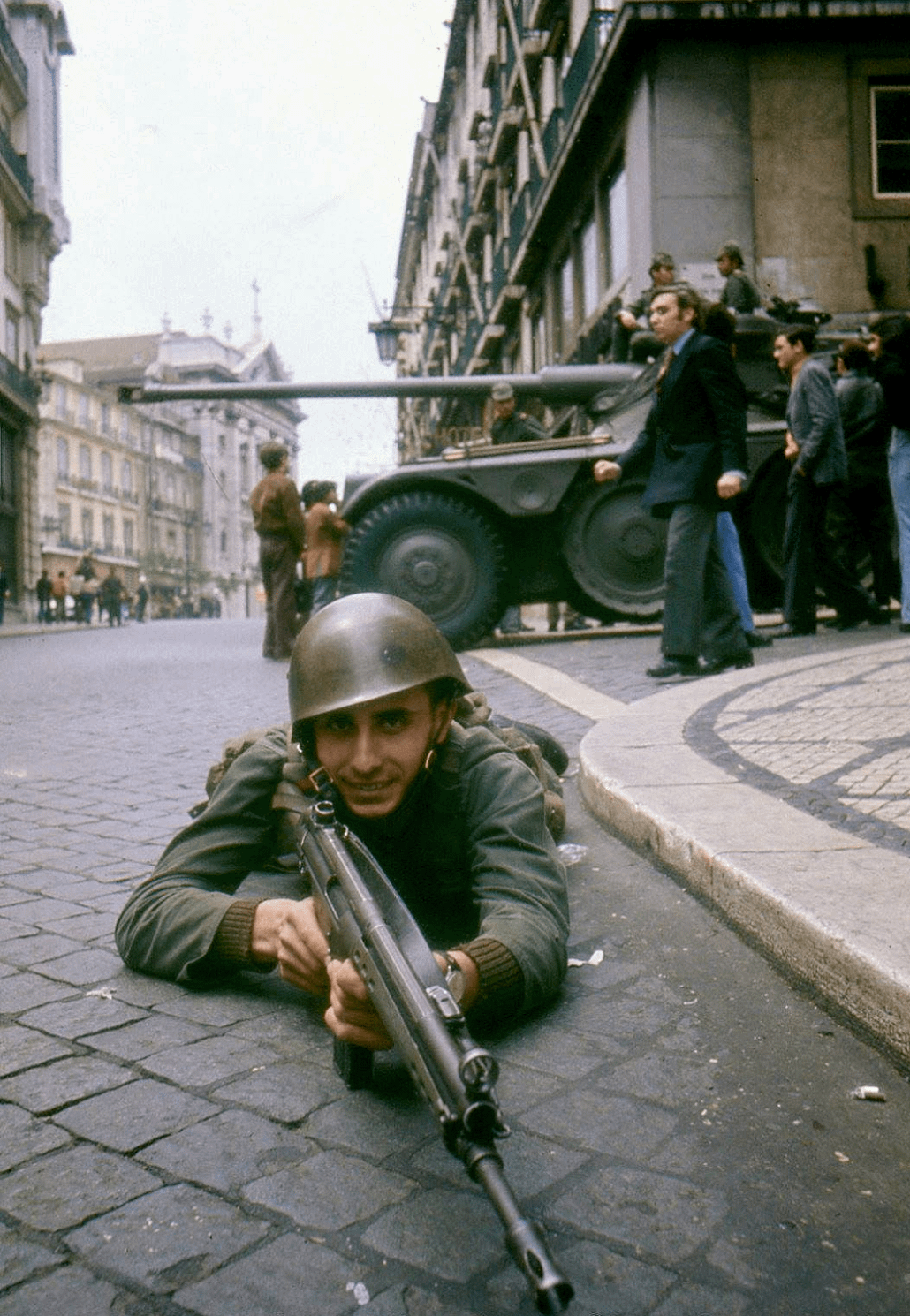 A Portuguese soldier during the “Carnation Revolution”, which was a near-bloodless coup carried out by the Armed Forces Movement (formed by officers who had served in Portugal’s Colonial War) that ended Portugal’s colonial empire and decades-long dictatorship. Lisbon, April 25, 1974. [1030×1490]