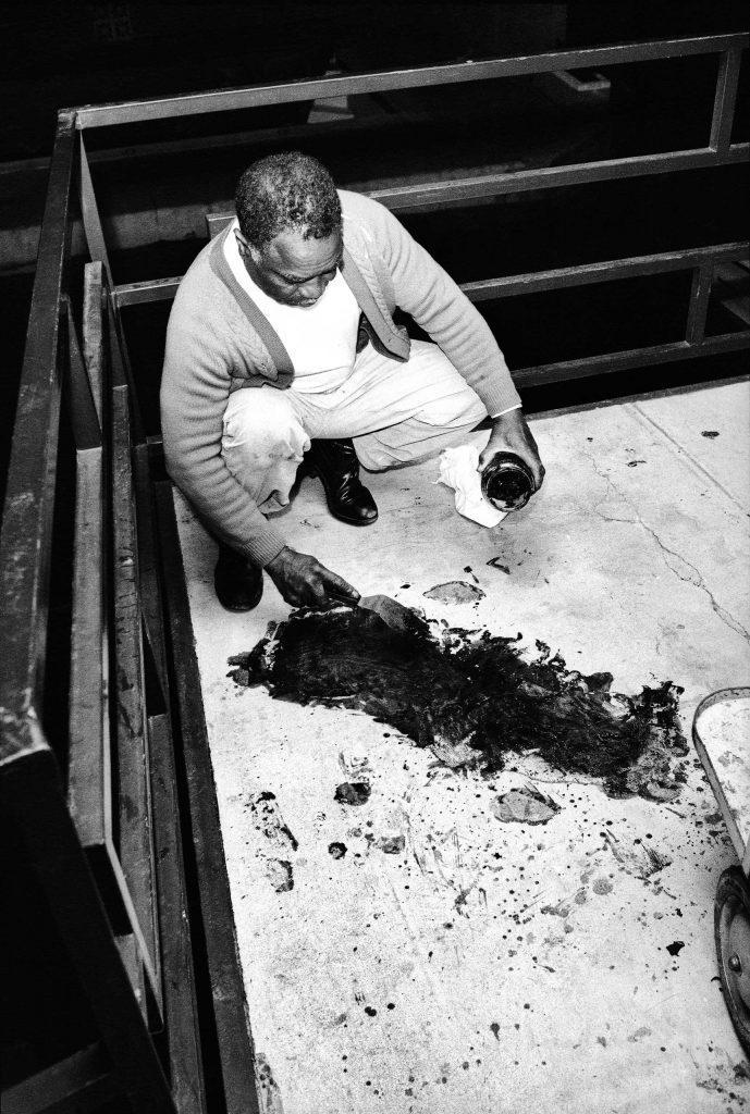 Theatrice Bailey attempting to clean Dr. Martin Luther King’s blood from the hotel balcony on which he was shot. On this day in 1968. (689×1024)