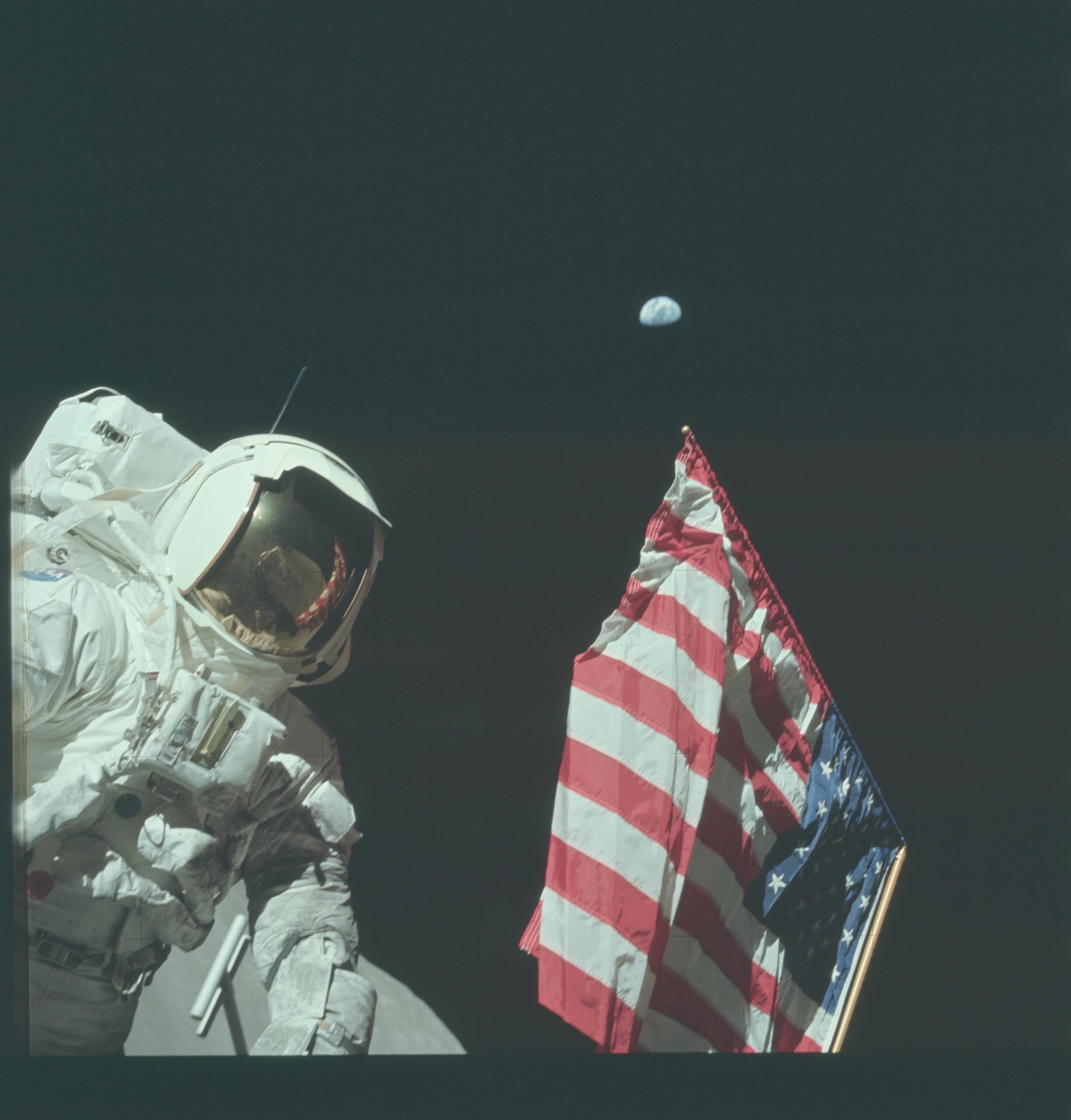 Apollo 17 Harrison “Jack” Schmitt took a break from moon walking to pose with the American flag and Earth, December 1972 [4400 × 4600]