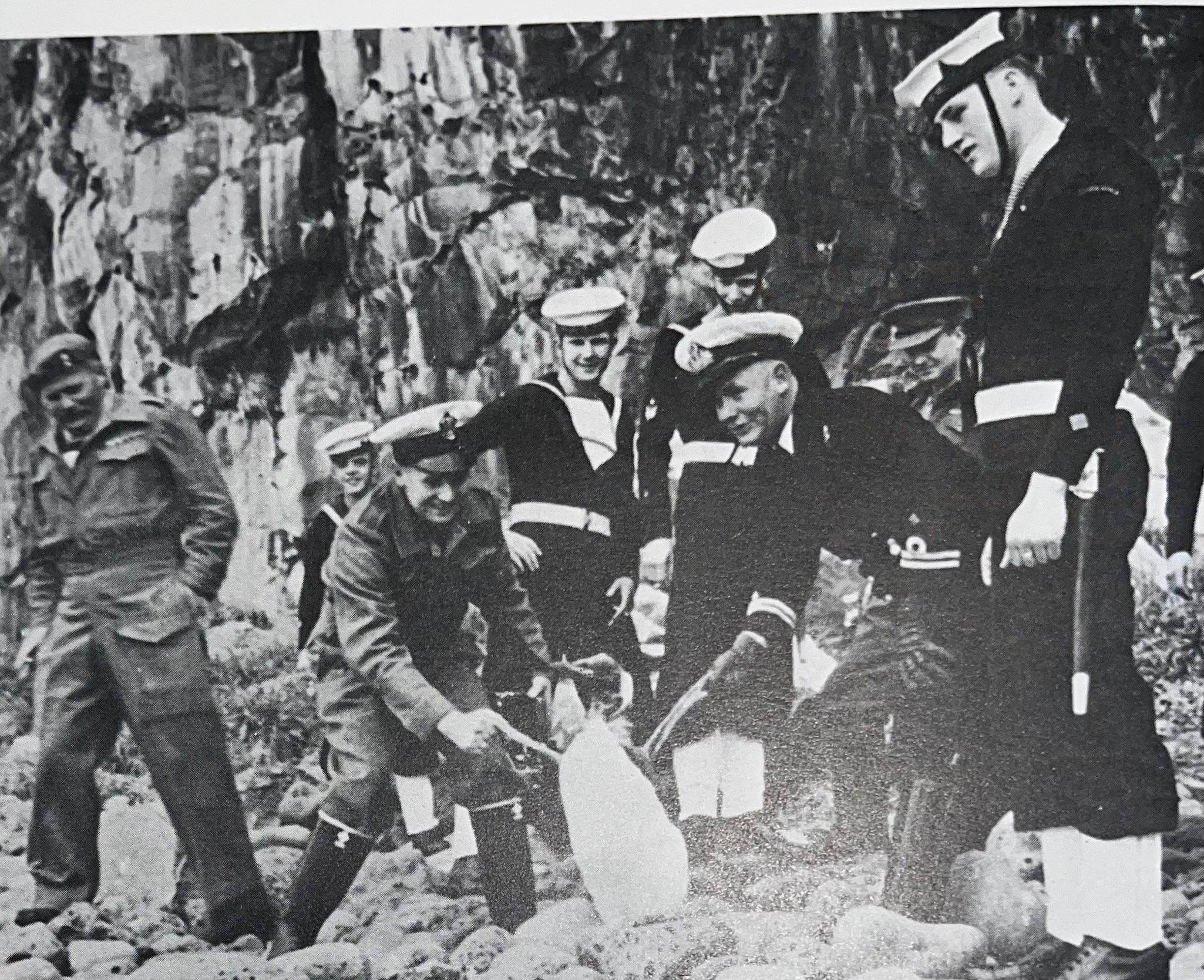 Men of the HMSAS Transvaal shake hands with an inhabitant of Marion Island. 1947, Marion Island [2050×1669]