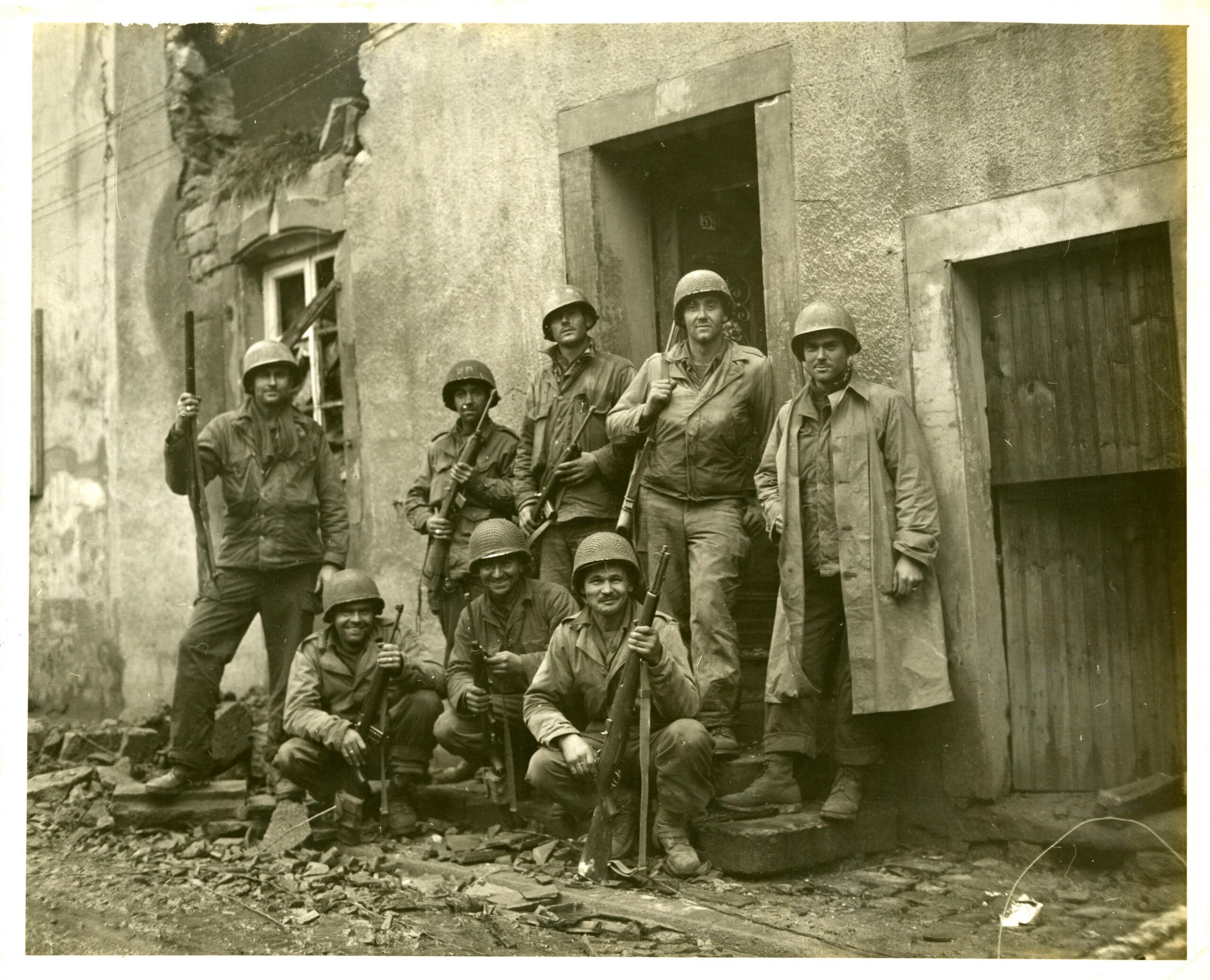 GIs of the 357th Regiment, 90th Infantry Division have just received word that their squad will be granted a thirty day furlough at home, plus two months travel time. Every soldier pictured here received The Purple Heart in the battle of Dillingen, Germany, February 6, 1945. [3600×2916]