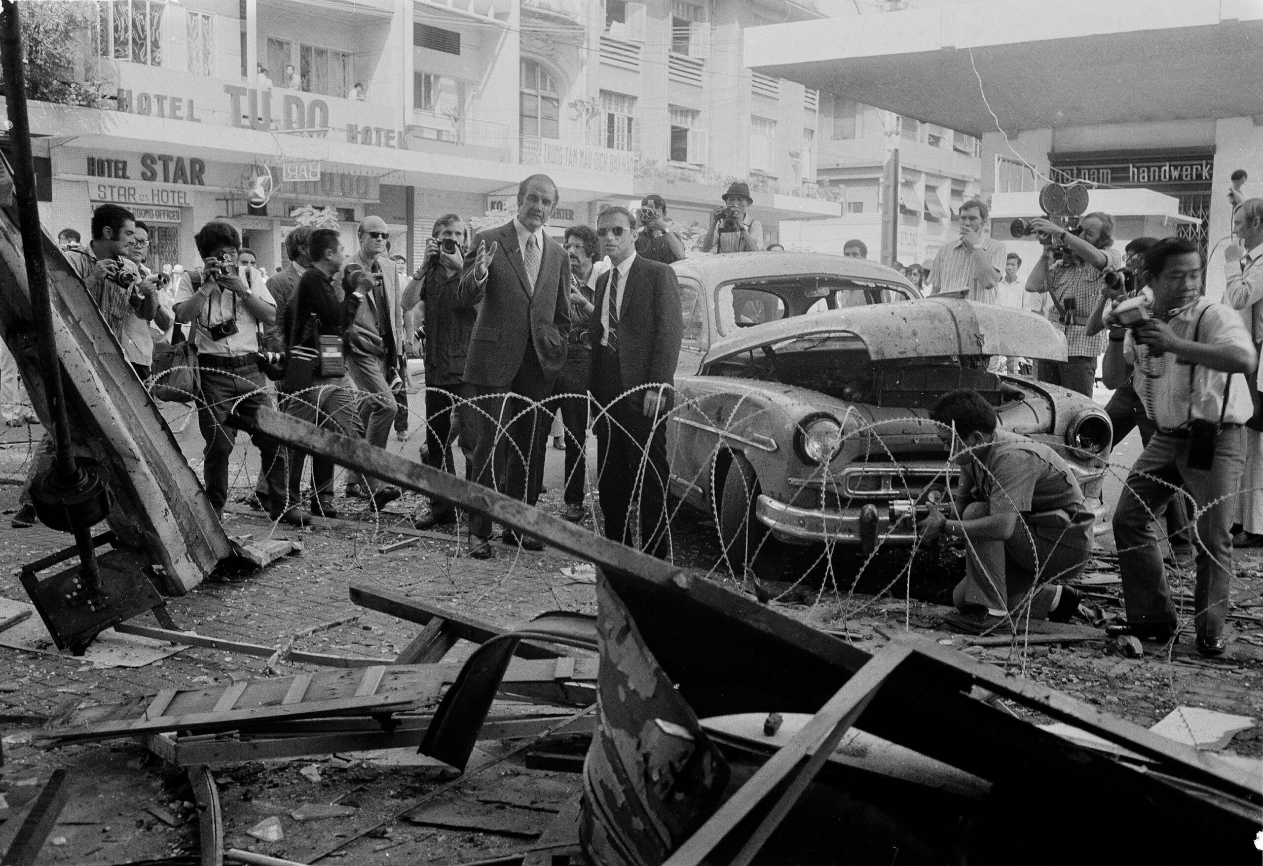 US Senator George McGovern viewing the wreckage of a bombed nightclub in Saigon during the Vietnam War. McGovern, who ran for presidency one year later, campaigned strongly against the war, but lost to Nixon. (1971) [3000×2059]
