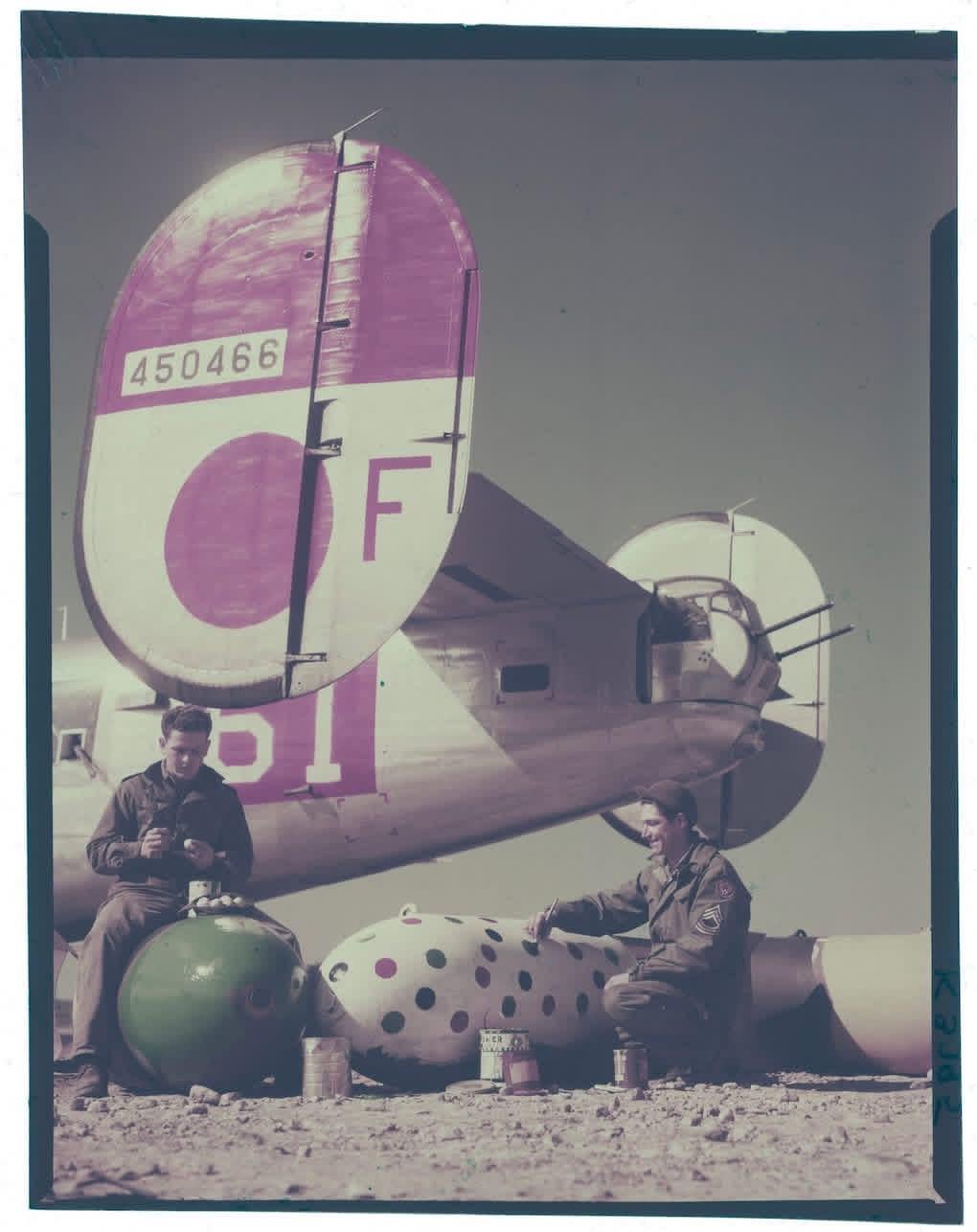 “Coloring Eggs That Will Go To Hitler. Sgt Herbert C. Wise of Bedford, Ky, left, and MSgt Tully D. Carr of Paul, Idaho, ordnance men of a MAAF B-24 gp, set to work with paint and brush to design ‘Easter Specials’ out of blockbusters.” Easter, 1945. [1020×1286]