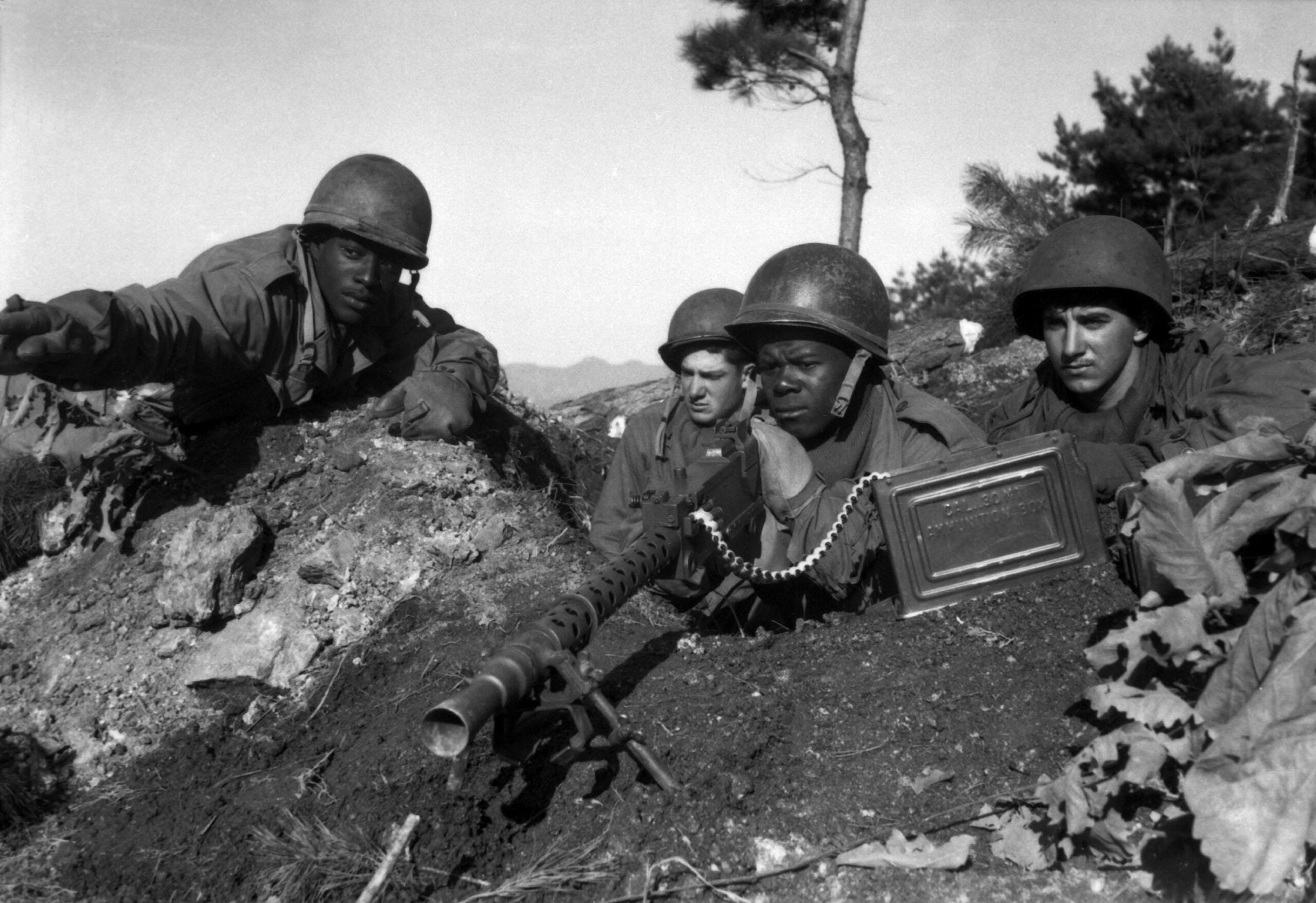 Fighting with the 2nd Inf. Div. north of the Chongchon River, Sfc. Major Cleveland, weapons squad leader, points out communist-led North Korean position to his machine gun crew. November 20, 1950. Pfc. James Cox. (Army) [3000×2058]
