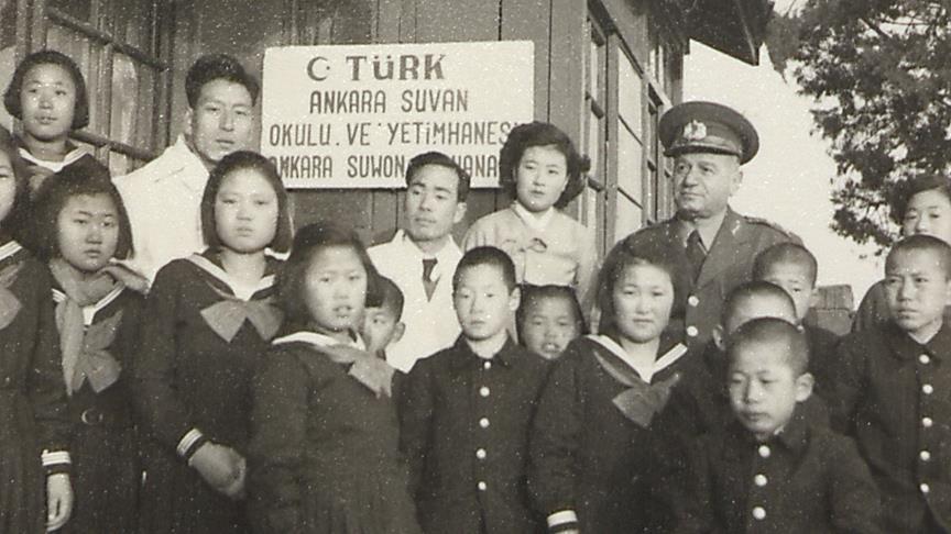 1950s, South Korea — Turkish troops standing with Korean war orphans they cared for and educated. A legacy of compassion beyond the battlefield.[1024×1025]