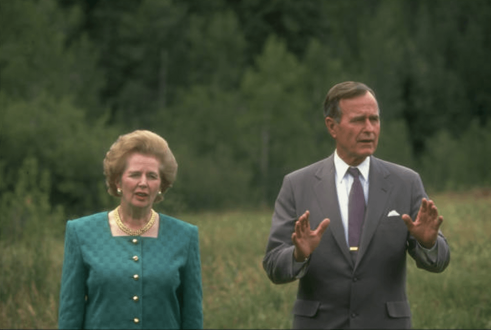 Margaret Thatcher and George H.W Bush speaking to reporters in Aspen [986 × 664] (1990)