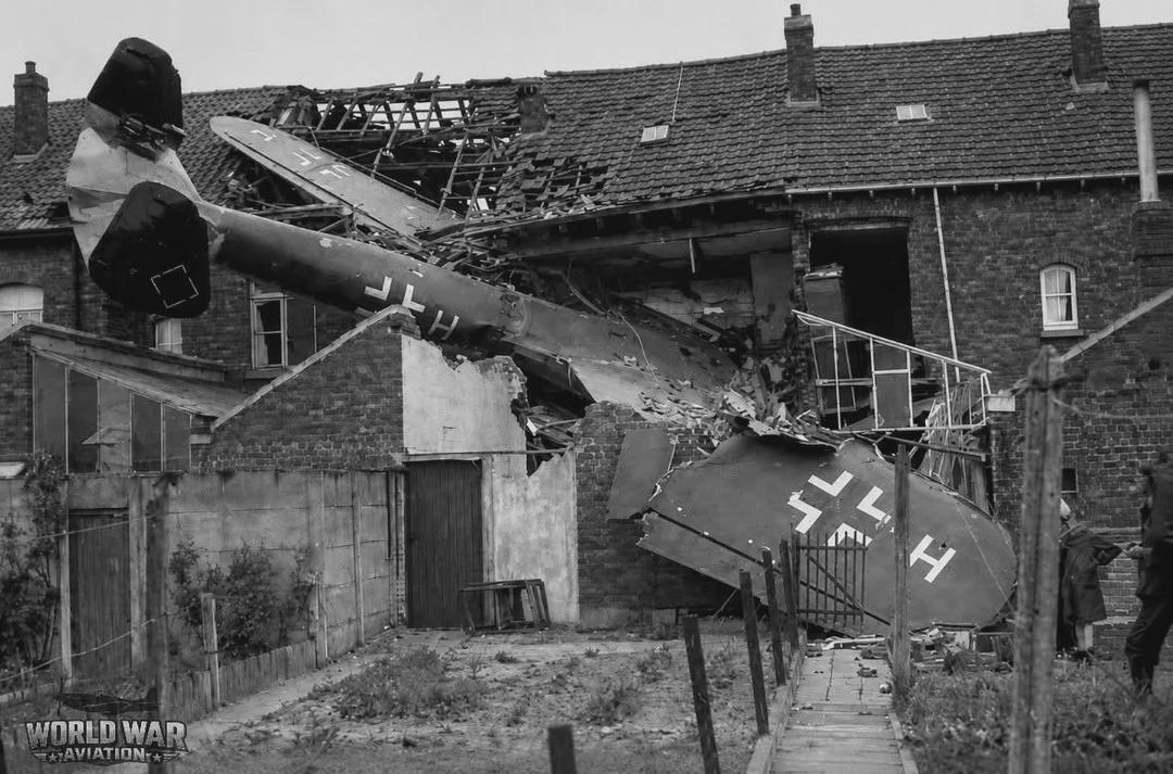 German Dornier Do-17 bomber crashes into a residential home in Belgium killing all four crew members along with two civilians in the house, 1940. [1080×713]