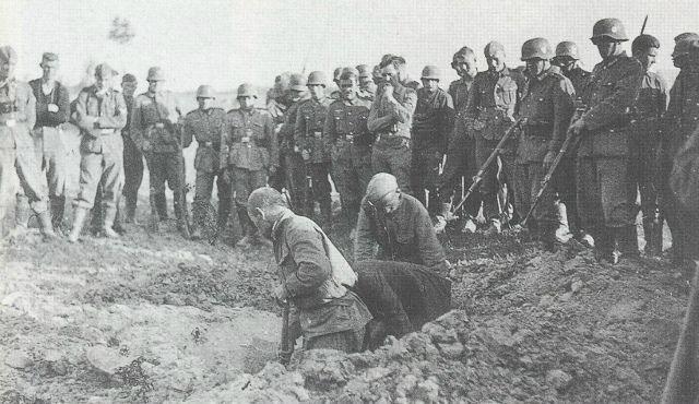 Soviet POWs dig their own graves before getting shot, surrounded by German soldiers, summer 1941. [640×370]