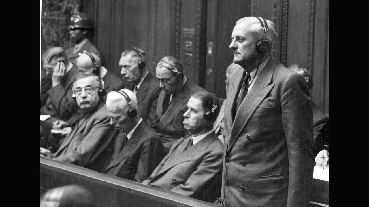 Otto Ambros, standing, listens to his verdict of eight years in prison by the U.S. Military Tribunal in Nuremberg, Germany, July 30, 1948. He only served three years before he was released and hired by major corporations because his expertise was too valuable. (1280 x 729)