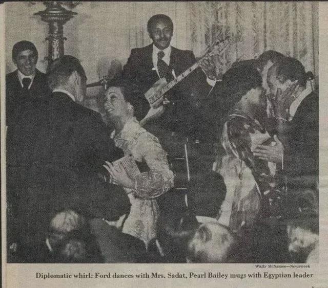 Diplomatic whirl: Ford dances with Mrs. Sadat, Pearl Bailey mugs with Egyptian leader (1975) [640×563]