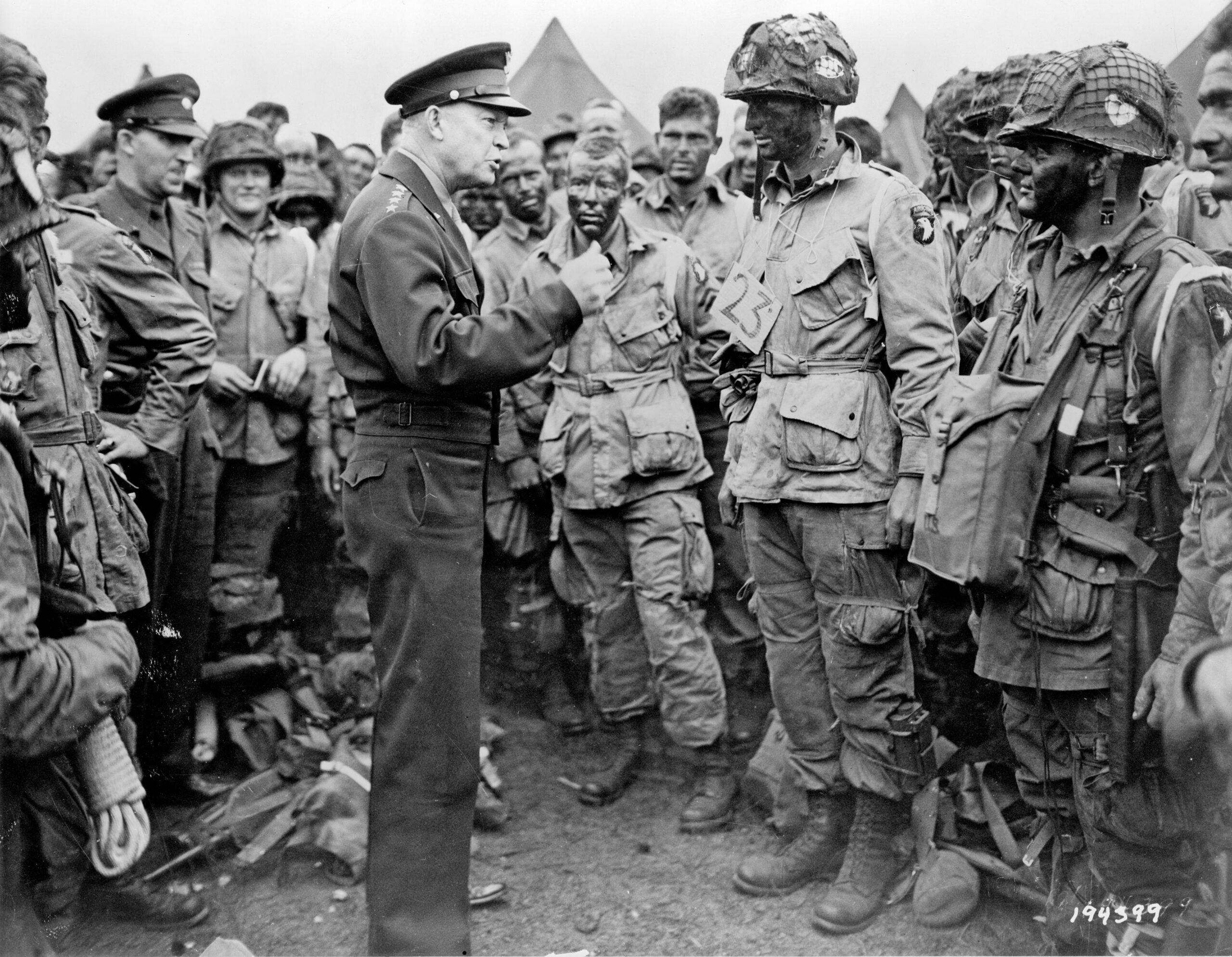 General Dwight D. Eisenhower speaking with 1st Lieutenant Wallace C. Strobel and men of Company E, 502nd Parachute Infantry Regiment on 5 June, 1944. [3924 × 3051]