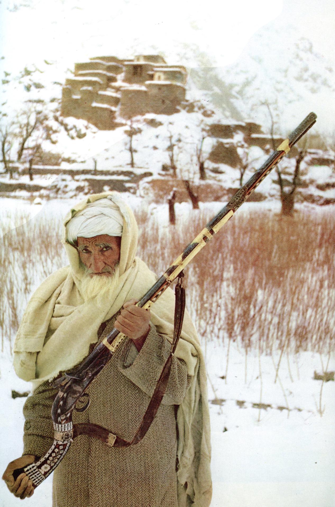 This photo taken in 1968 depicts an Afghan man holding a traditional Pashtun rifle known as a Jezail [1267×1920]