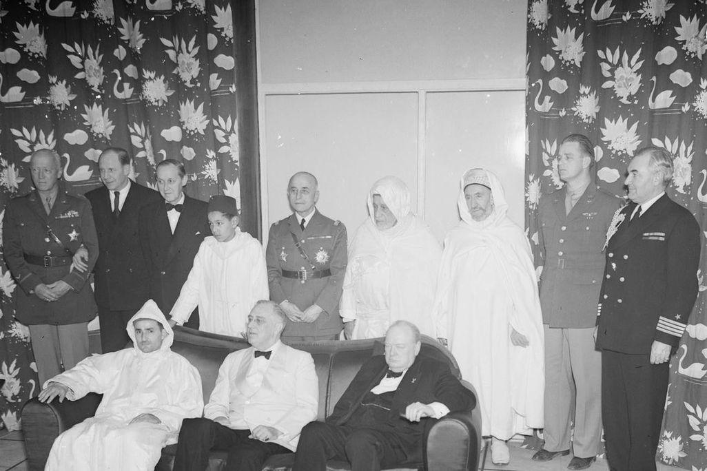 Mohammed V(King of Morocco) (seated at left) with Franklin D. Roosevelt (center) and Winston Churchill (right) at a 1943 war conference near Casablanca[1026×684].