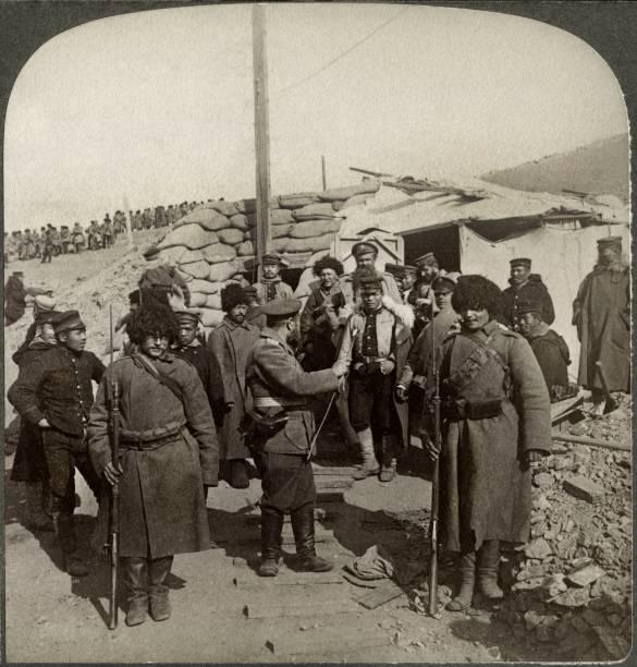 Russian soldiers who surrendered after the Siege of Port Arthur in 1905 changing guards with Japanese soldiers [585 x 612]