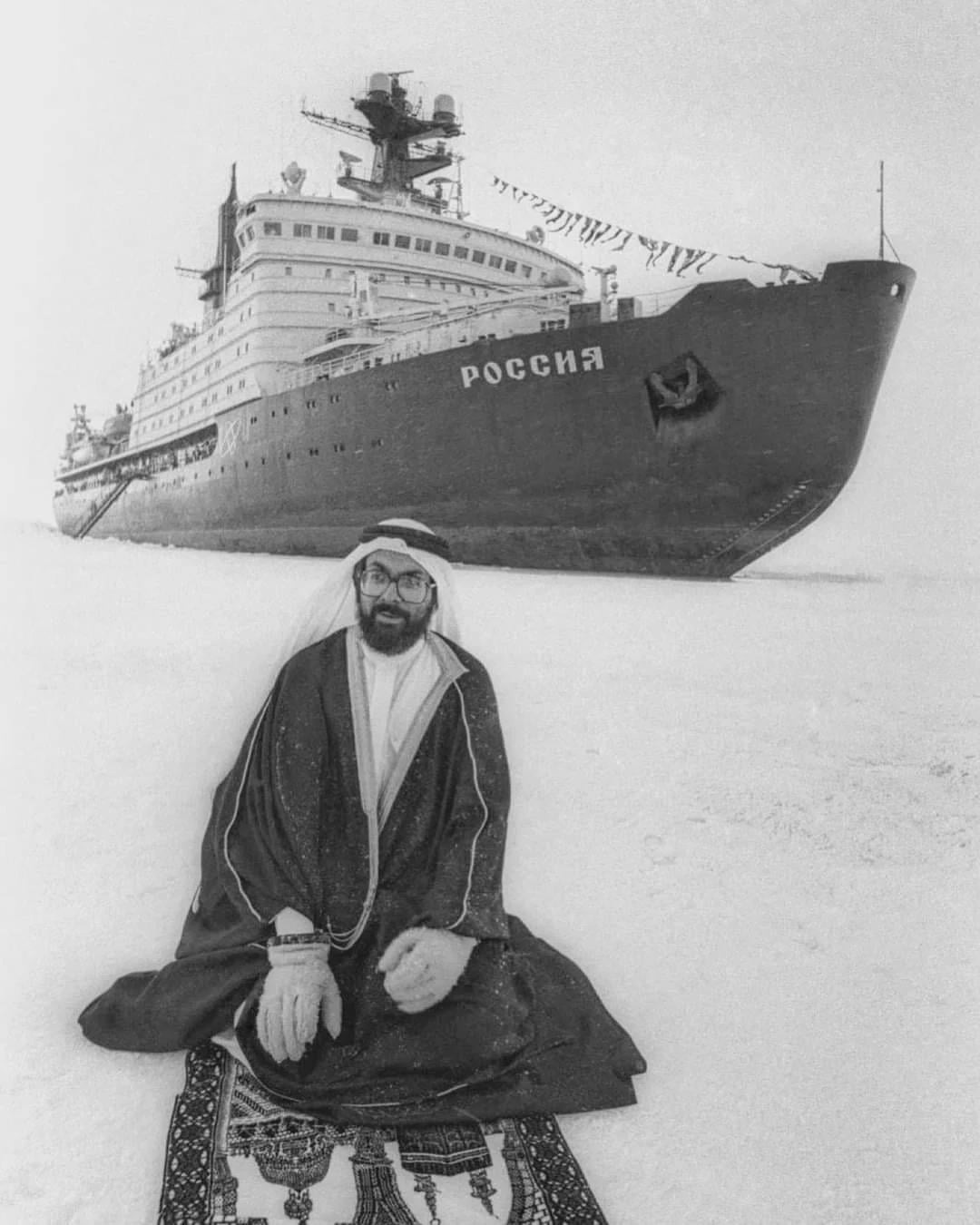 A tourist from Saudi Arabia prays at the North Pole against the background of a Soviet nuclear icebreaker, 1990. [1080×1350]