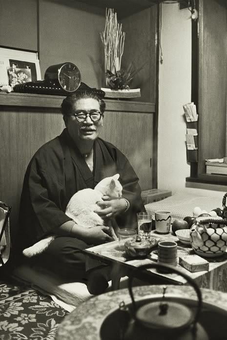 Inejirō Asanuma, leader of the Japan Socialist Party, at home with his cat, 1960. [465×694]