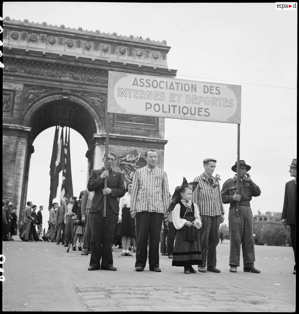 9 May 1945: During VE-Day celebrations in Paris, a procession of wartime political prisoners and deportees at the Arc de Triomphe [1218×1280]
