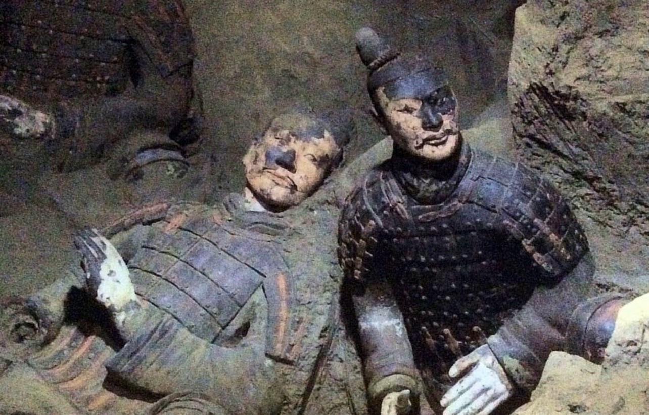 Freshly excavated Terracotta Army soldiers with traces of their original paint, 1974 [1284X820].