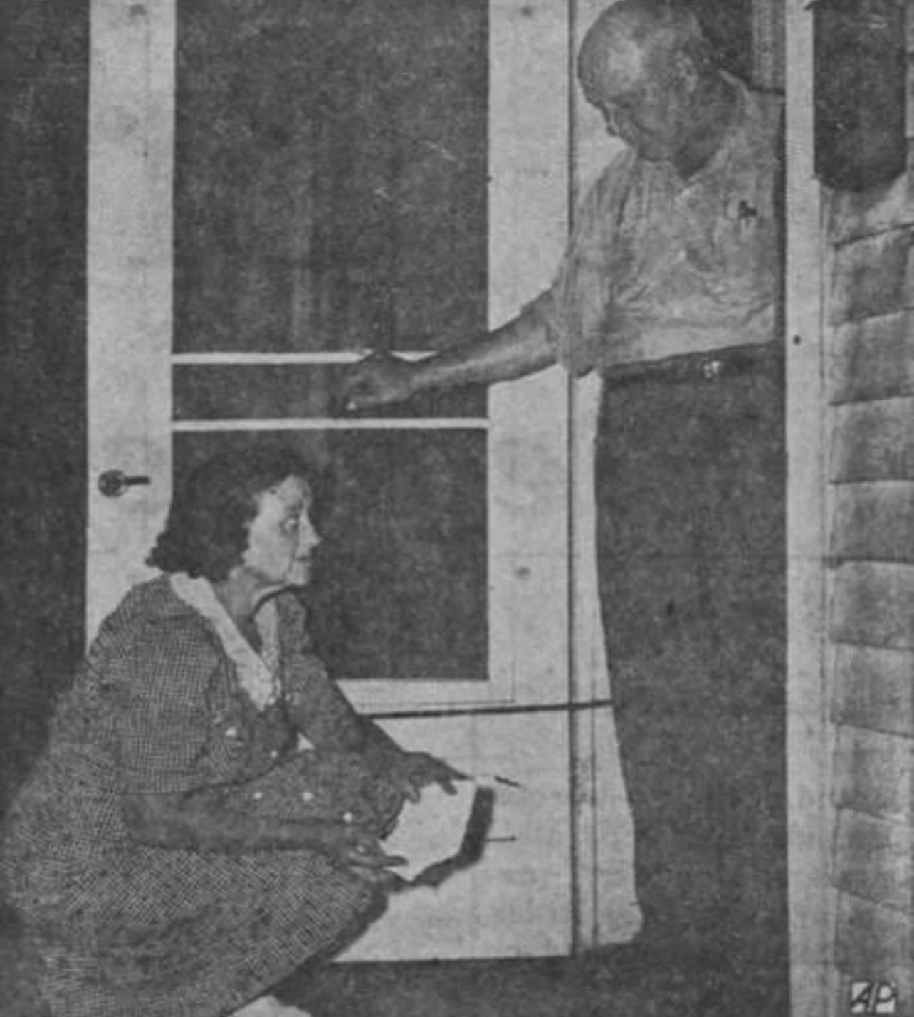Beulah Cordes reenacts the discovery of the cloth that allegedly sent “a feeling of paralysis” through her body, one of at least twenty reported encounters attributed to the Mad Gasser in Mattoon, 1944[1284X1428]